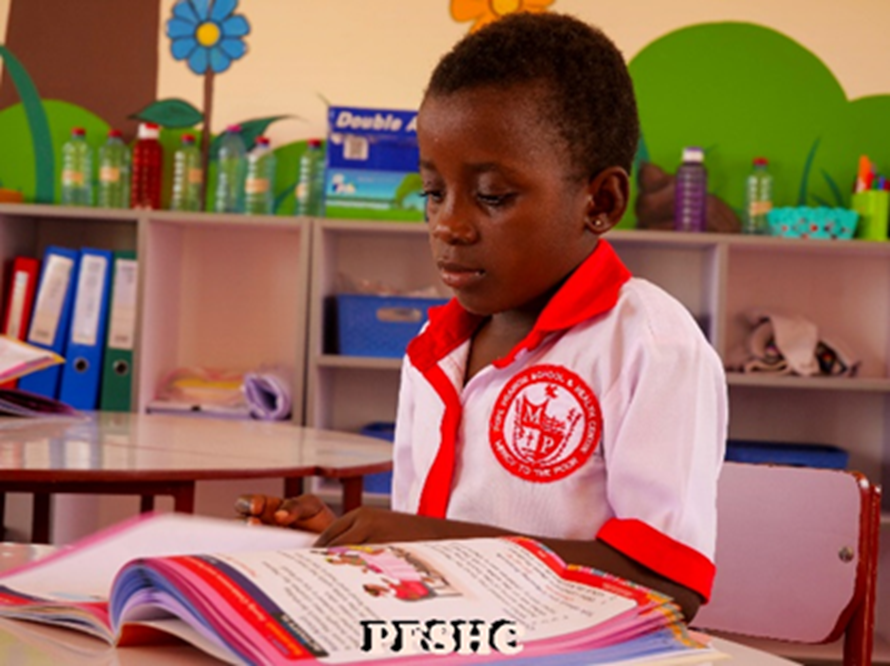 young female student reading a book at Pope Francis school