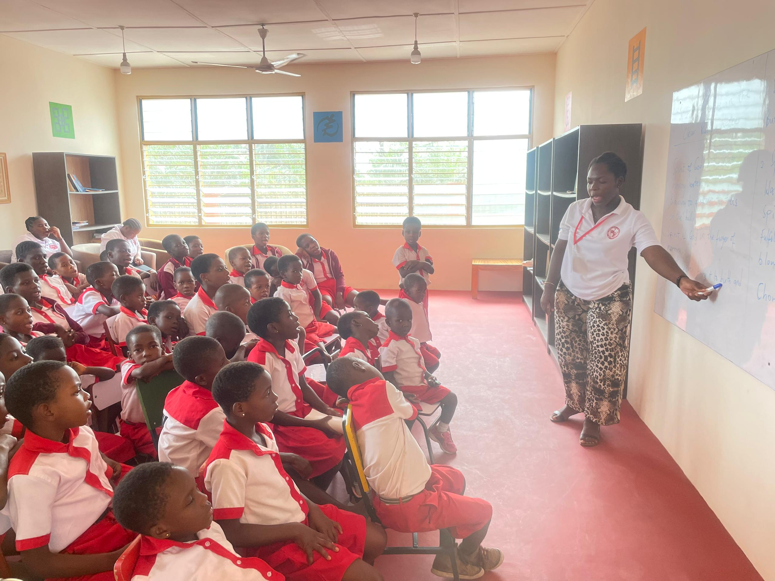 young female student reading a book at Pope Francis school